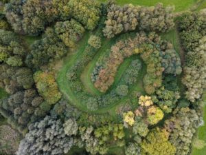 aerial drone shot over Earth Trust Broad Arboretum LIttle Wittenham Oxfordshire UK native tree collection