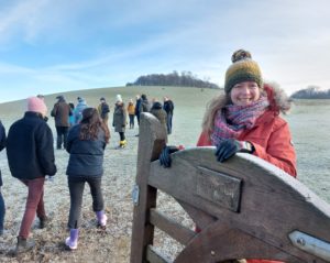 access to green space - visitors entering gate at wittenham clumps with lady smiling holding gate open