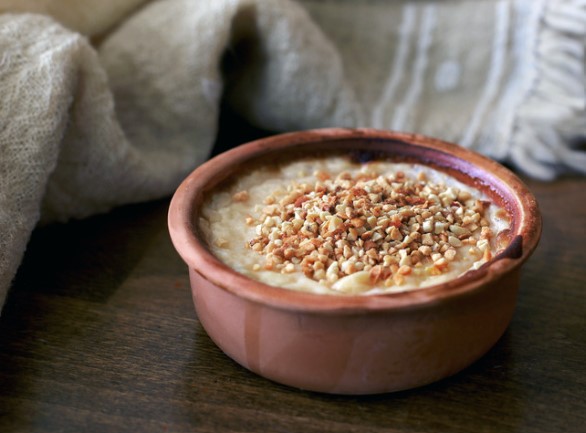Roman style baked pear pudding in terracotta dish