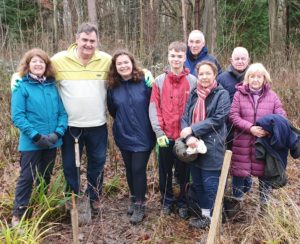 Keith Hickman and family planting a memorial tree