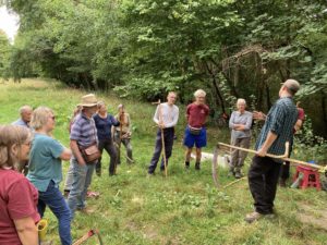 Volunteers scything training