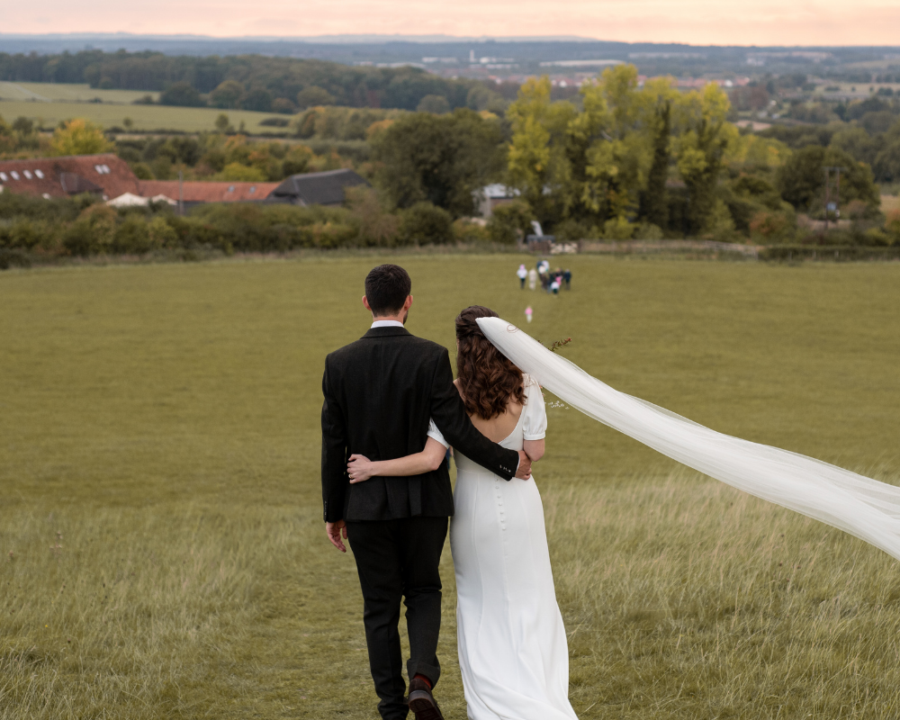 Wedding couple looking down from the top of the Clumps. Credit: Nicola Belson Photography