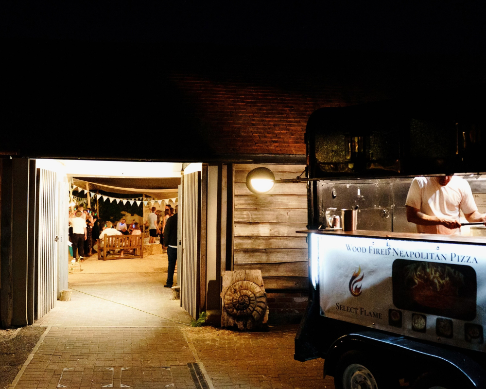 Pizza van parked outside Fison Barn catering for an evening party or wedding